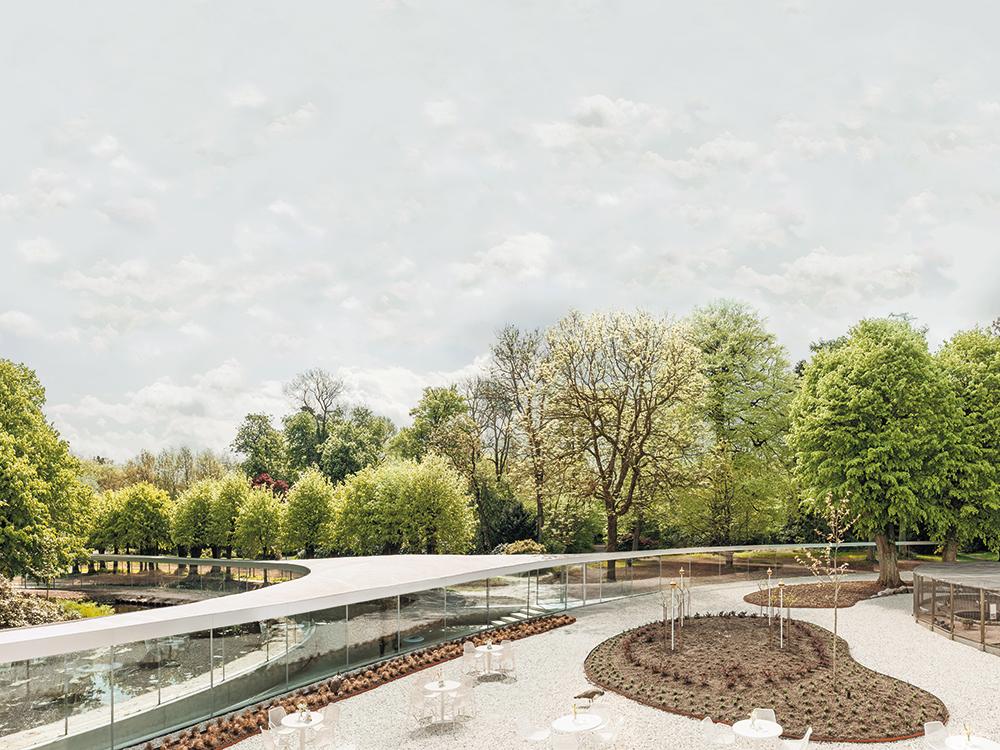 Thanks to the organic form and the loadbearing glass facade the pavilion is harmoniously integrated in the park Conceived as an addition to a villa dating from the 18th century, it provides space for events.