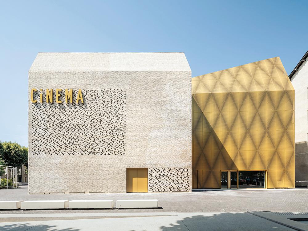 For the new cinema in Cahors in southern France the office of Antonio Virga Architecte designed a brick facade that seems almost weightless due to omitting individual bricks.