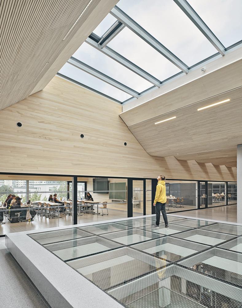 The skylight and the glass floor allow daylight to enter through the roof, through the staircase and into the lower levels.