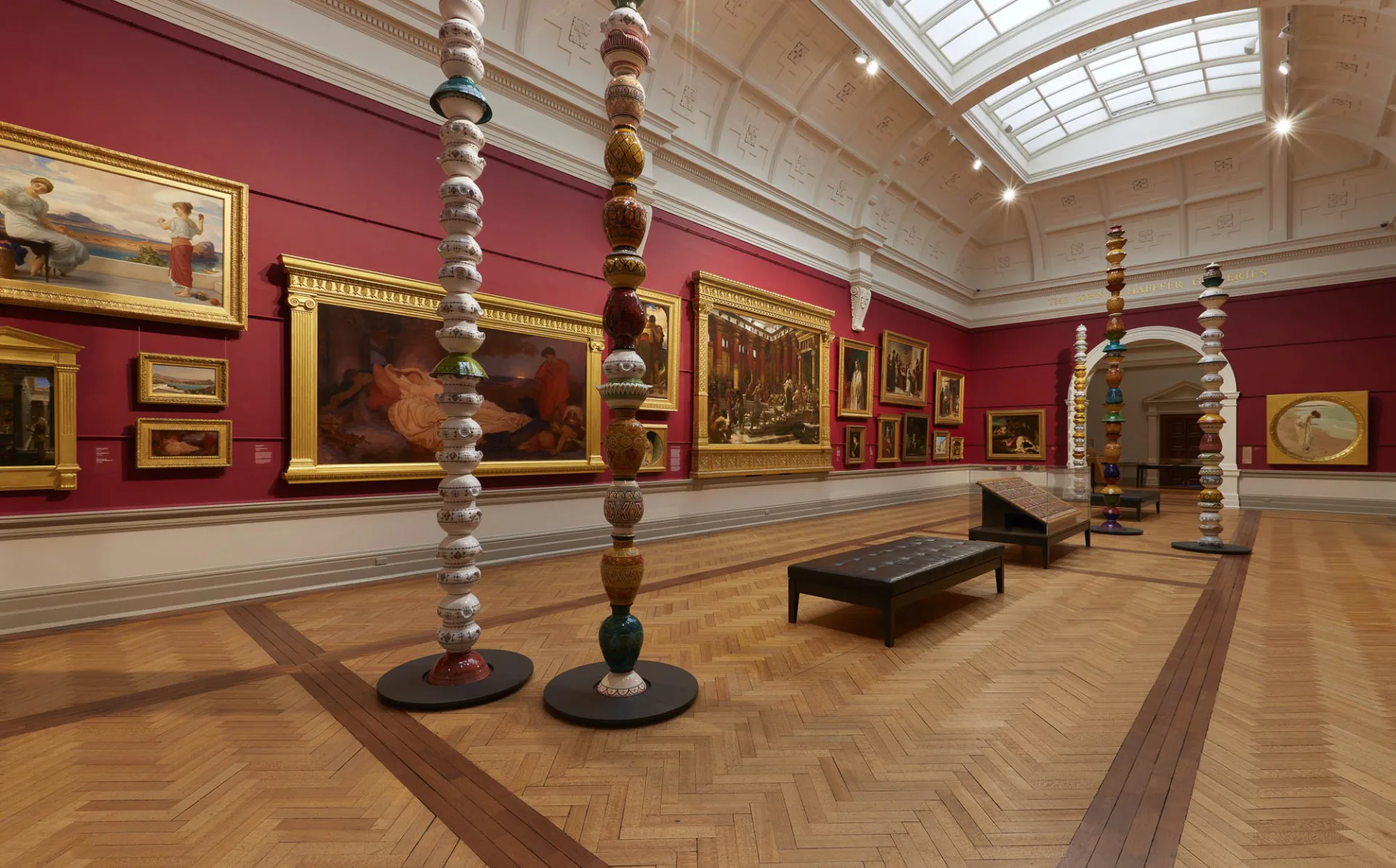 Installation view of the Grand Courts at the Art Gallery of New South Wales, featuring Pascale Marthine Tayou Colonnes Pascale 2012, photo