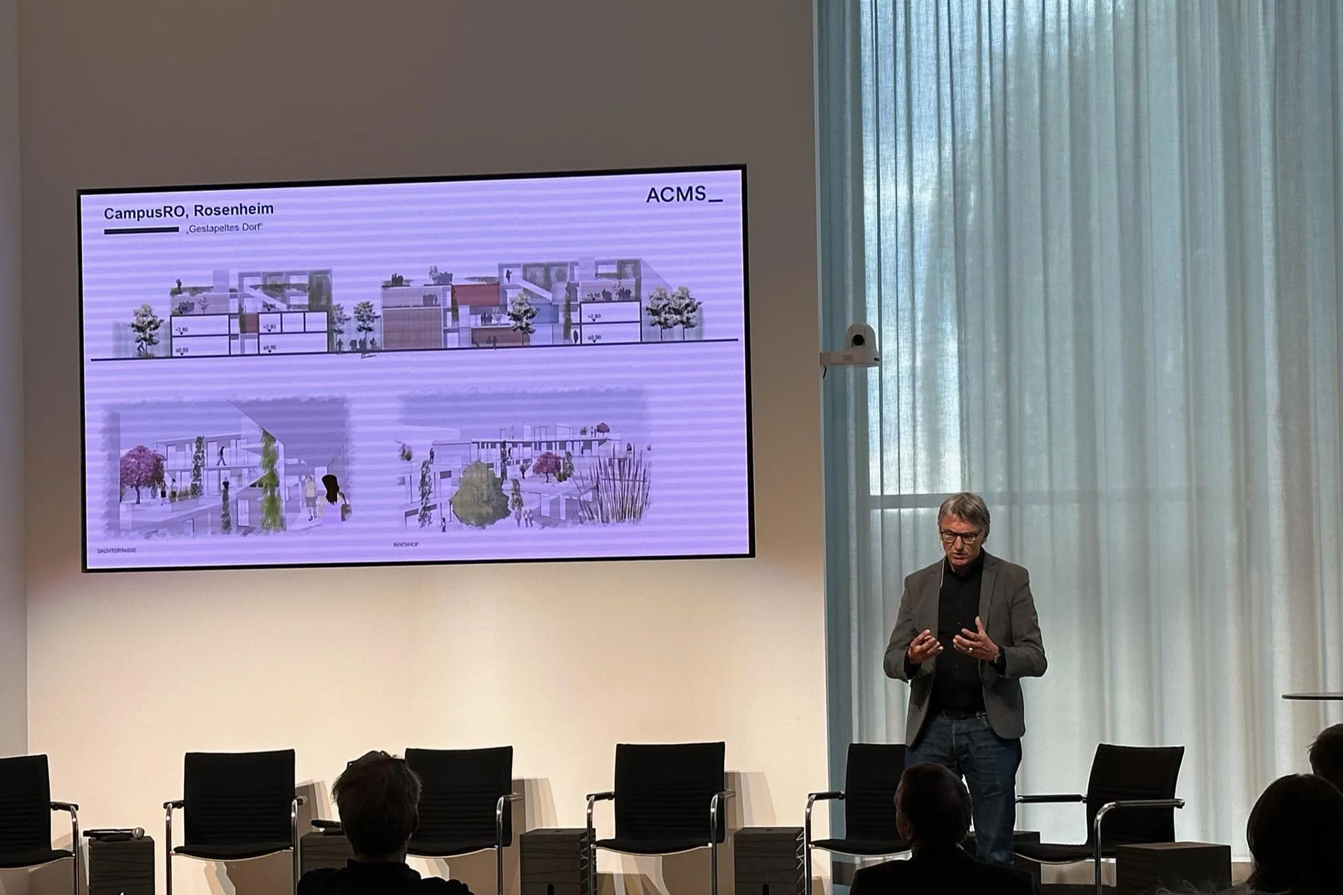 Christian Schlüter von ACMS Architekten berichtete über den Campus RO in Holzhybrid-Bauweise.