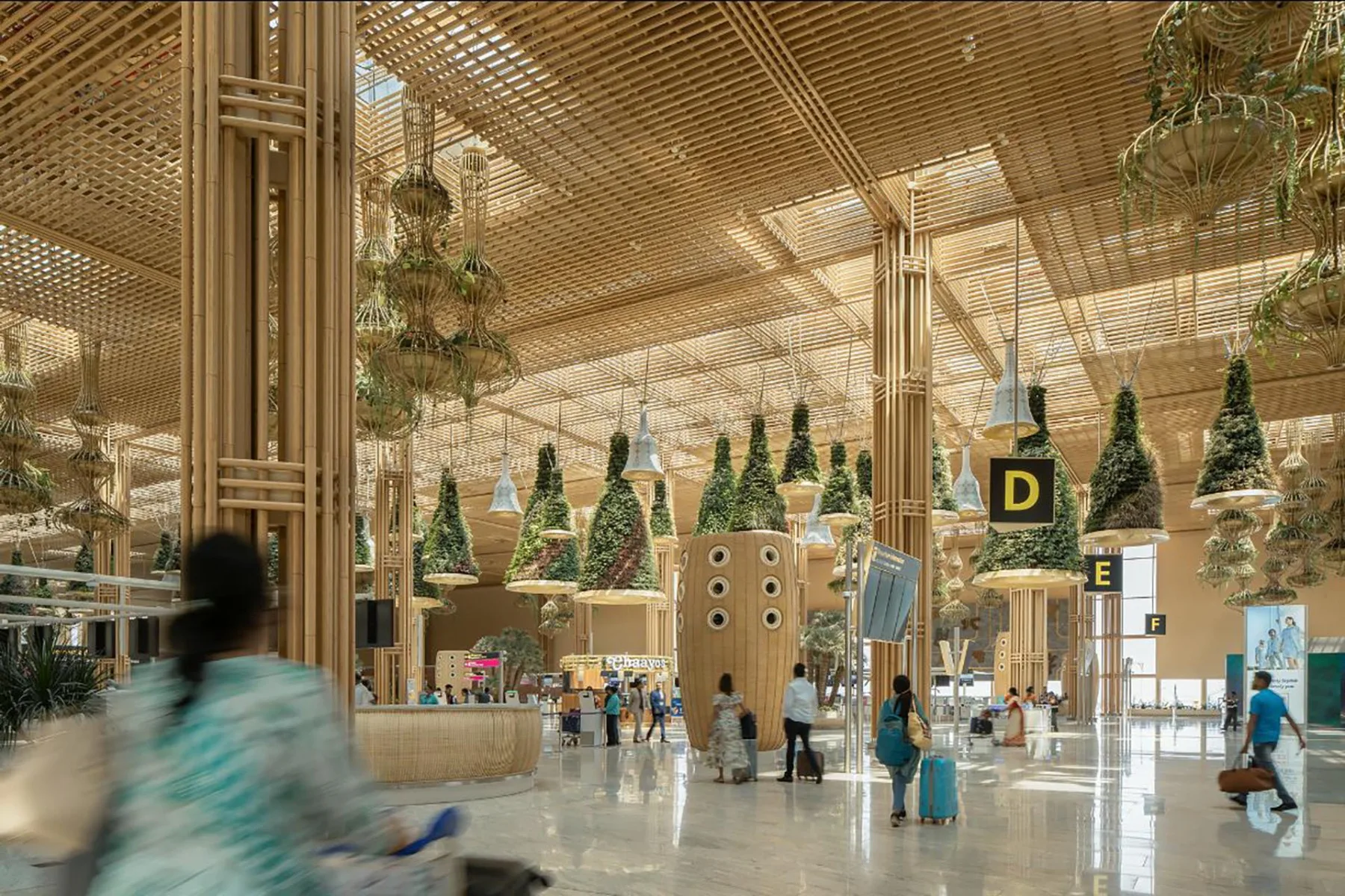 Rundprofile aus verleimtem Bambusholz umhüllen die Tragstruktur des Kempegowda International Airport. Visualisierung