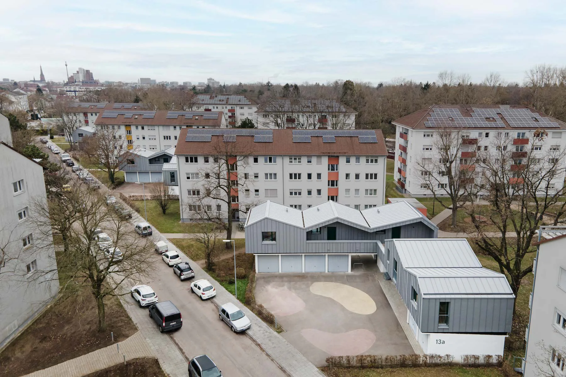 Three extended garages in the middle of the 1950s residential development.
