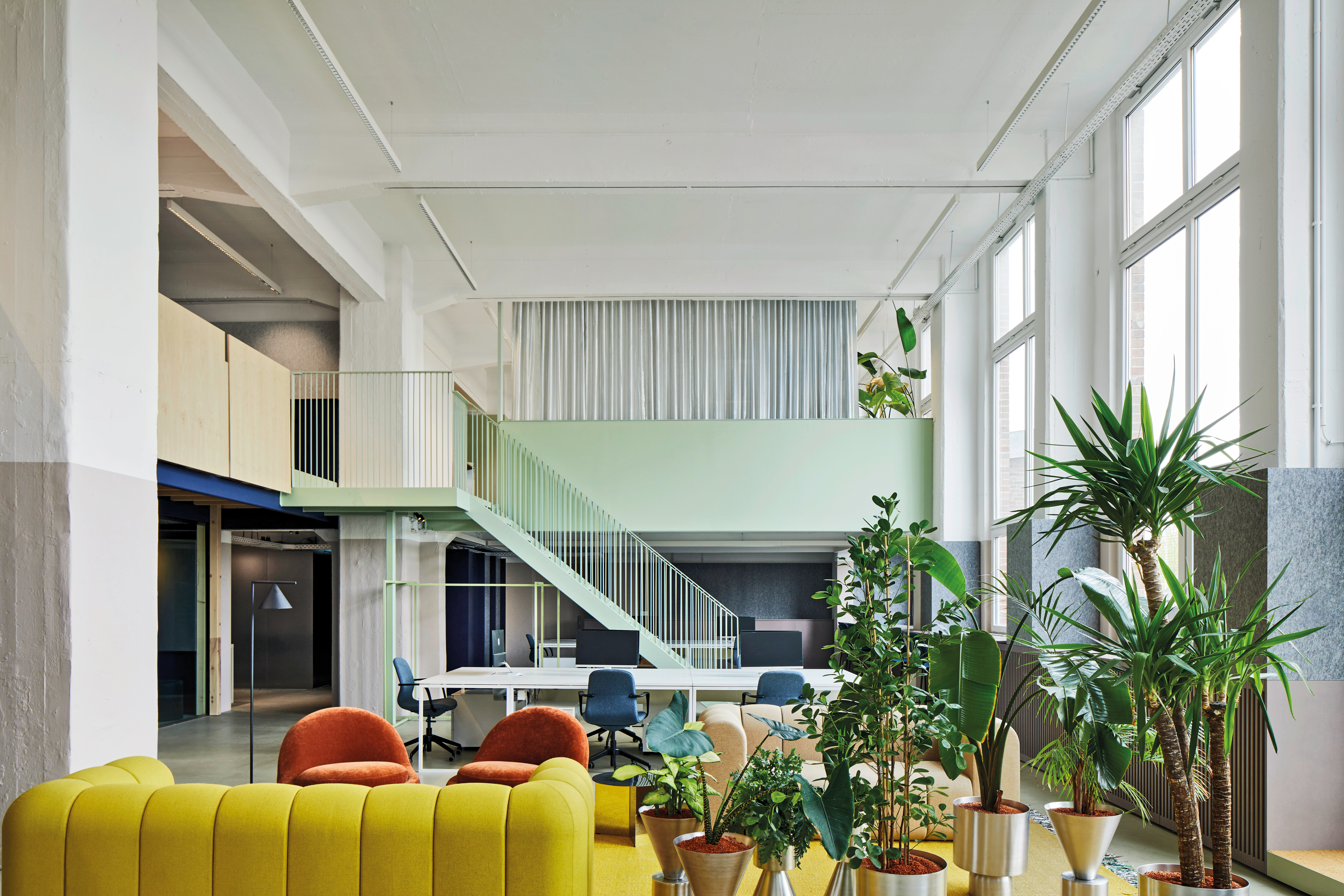 The two-storey main space is bordered by an L-shaped gallery housing a small-scale range of differentiated rooms.
