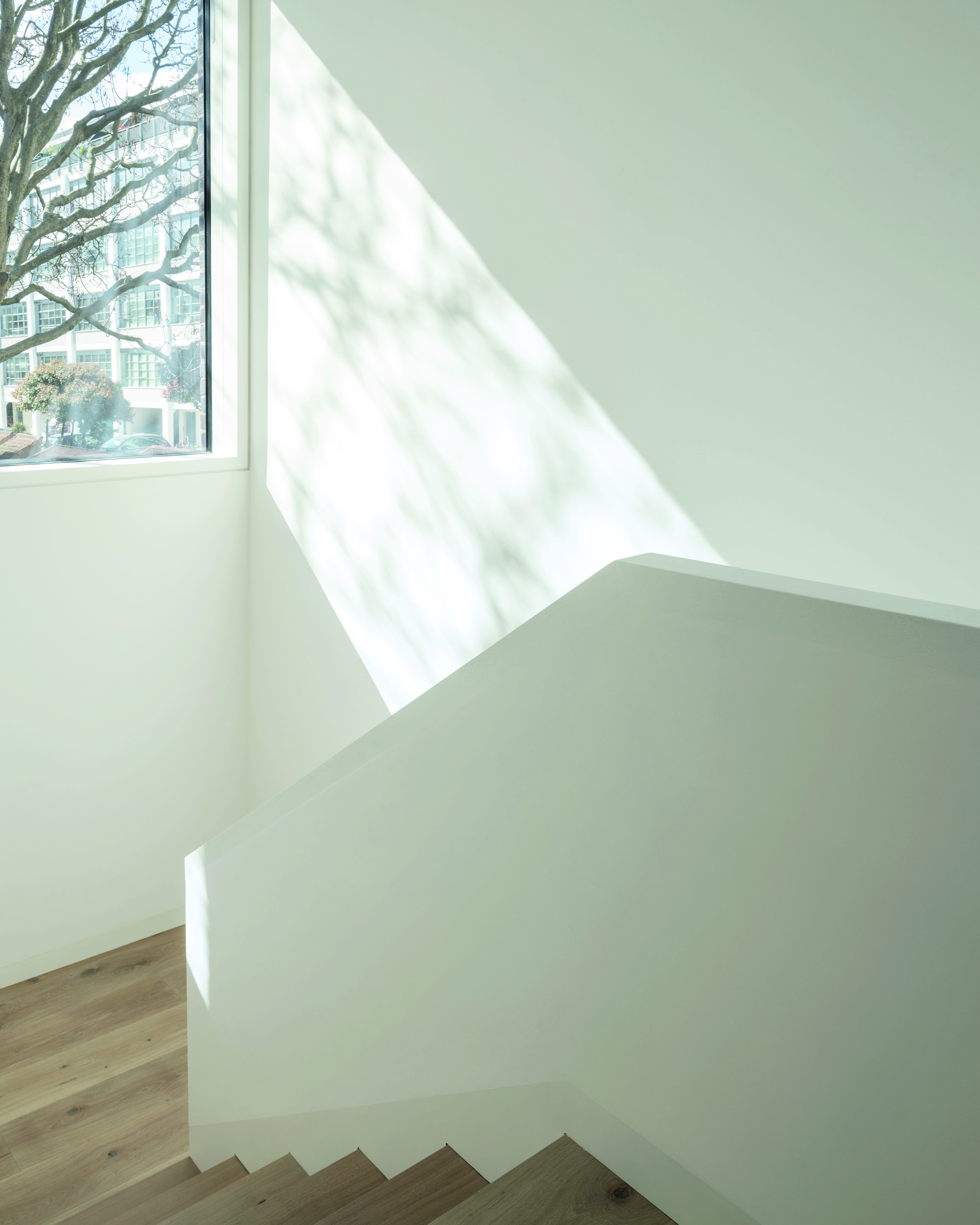 A large window allows ample daylight to enter the new stairwell