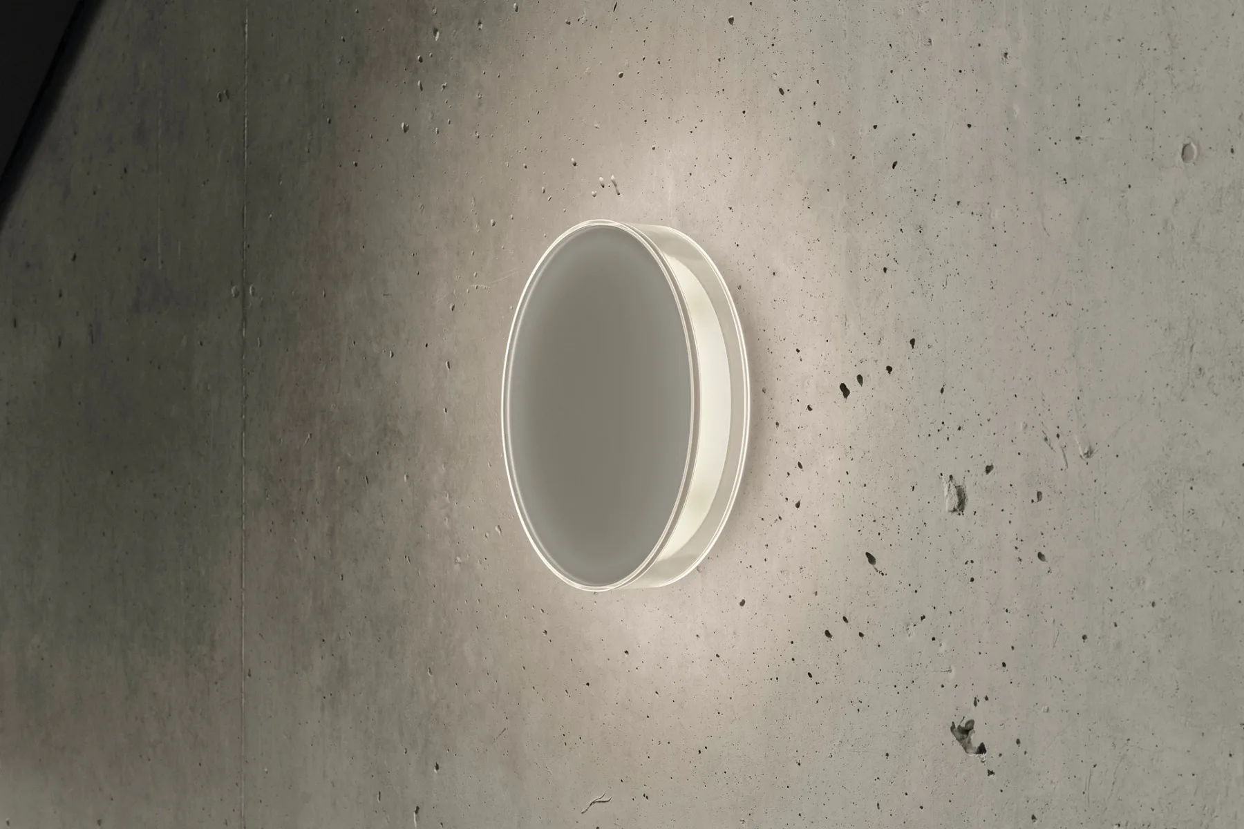 Der Erschließungskern wird durch die Lid Wall-Leuchten von Serien Lighting akzentuiert, die tagsüber dezent als Designobjekte in die Architektur integriert sind.