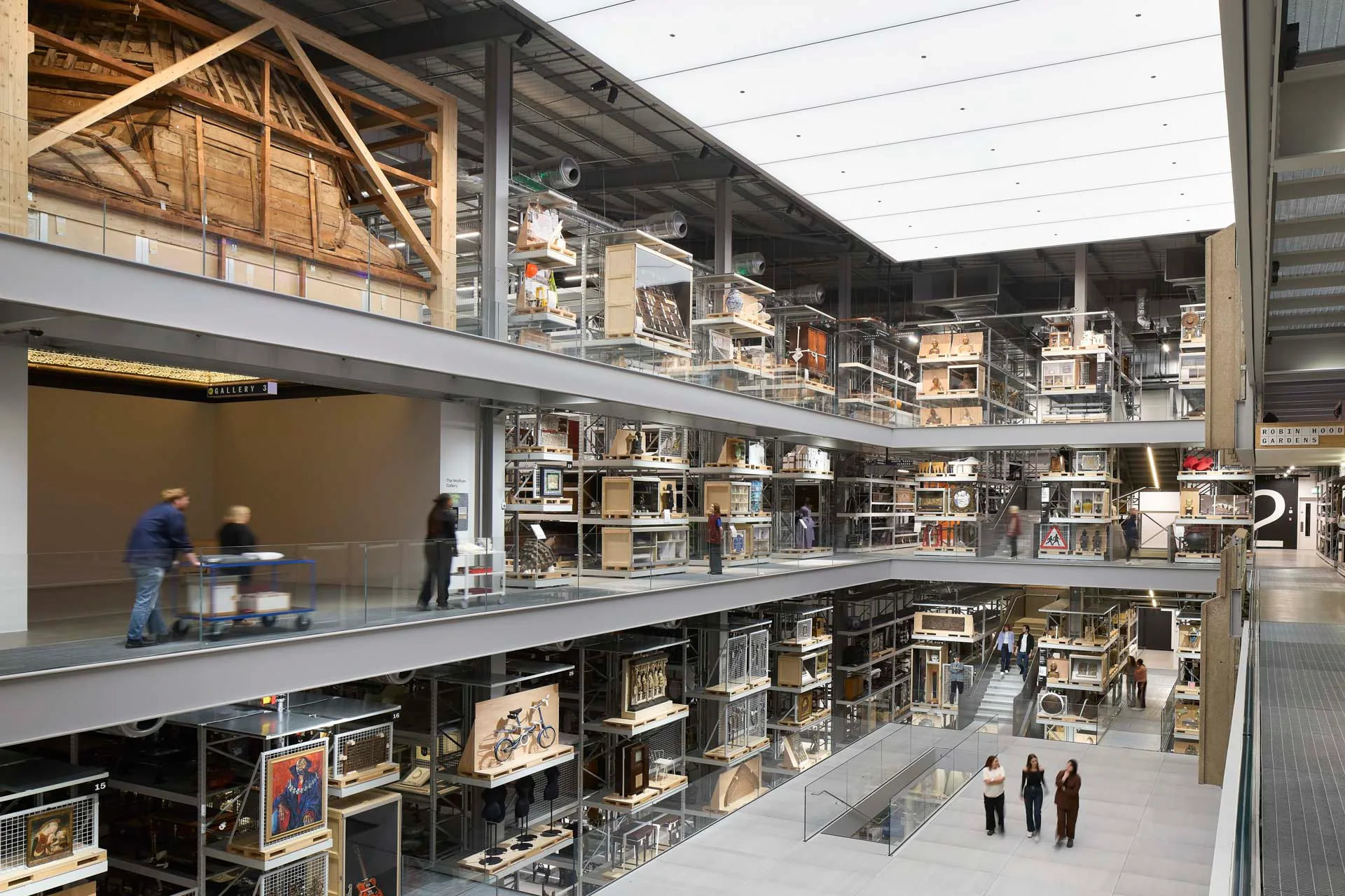 At the top left of the image is a carved and gilded wooden ceiling from the now lost Torrijos Palace near Toledo in Spain. Measuring 6.5 m x 6.5 m x 5.6 m, it is the largest object in the V&A East Storehouse by cubic volume.