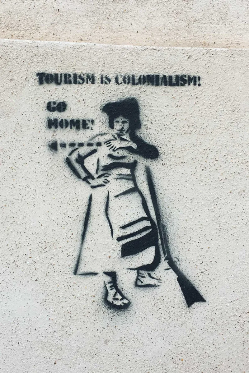 “Tourism is colonialism! Go home!”
