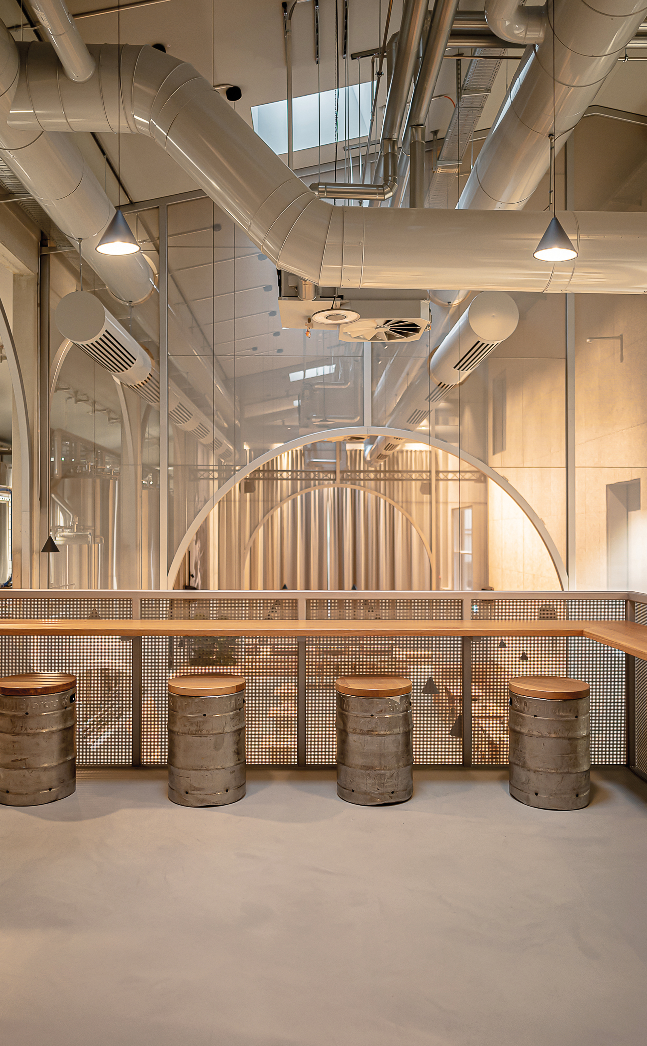 Old beer barrels serve as seating furniture.