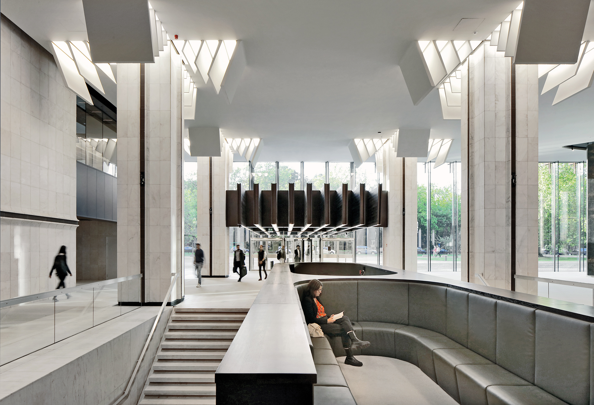 New elements, such as the built-in structures in the foyer are seamlessly integrated in the existing architecture.